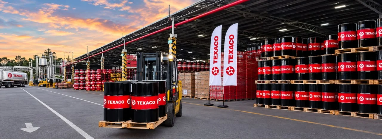 Texaco lubricant drums and a tanker at a lubricants warehouse